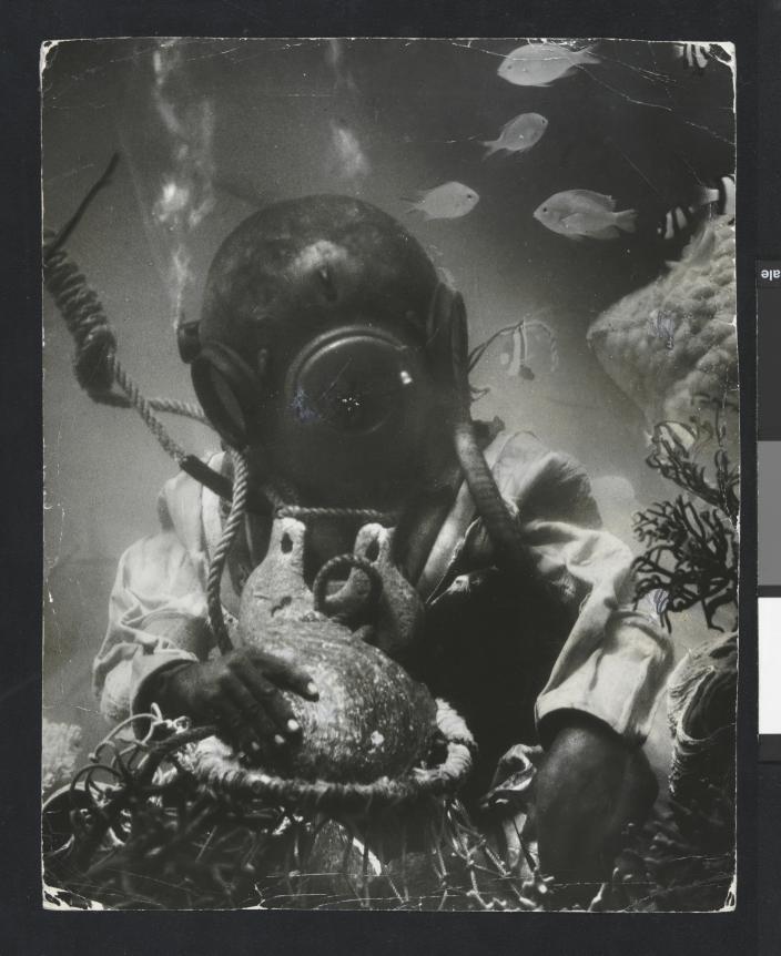 Staged photographed of an underwater scene with a hard-hat diver